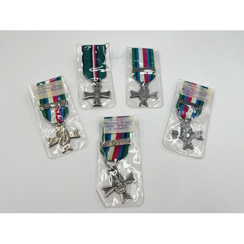 2302 - Five WWII Polish medals, four 1939-1945 Military Cross Of Combat and one National Defence