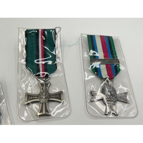 2302 - Five WWII Polish medals, four 1939-1945 Military Cross Of Combat and one National Defence