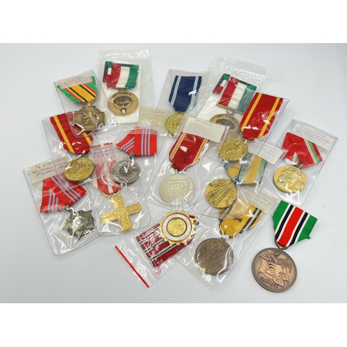 2304 - Fifteen WWII and later medals to include National Front for the Liberation of South Vietnam Resoluti... 