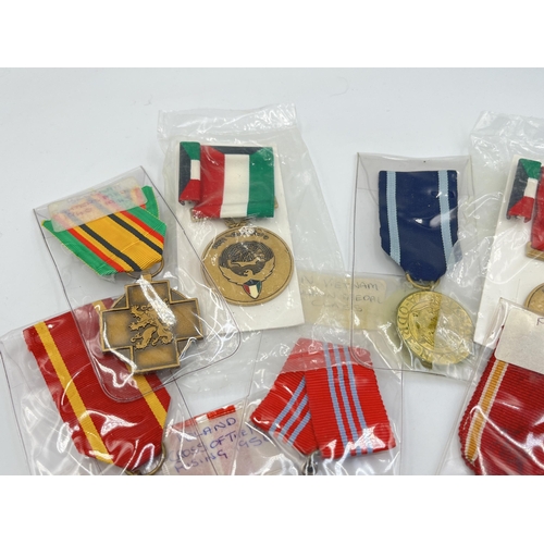 2304 - Fifteen WWII and later medals to include National Front for the Liberation of South Vietnam Resoluti... 