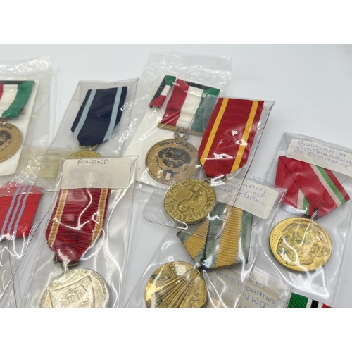 2304 - Fifteen WWII and later medals to include National Front for the Liberation of South Vietnam Resoluti... 