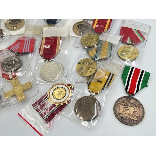 2304 - Fifteen WWII and later medals to include National Front for the Liberation of South Vietnam Resoluti... 