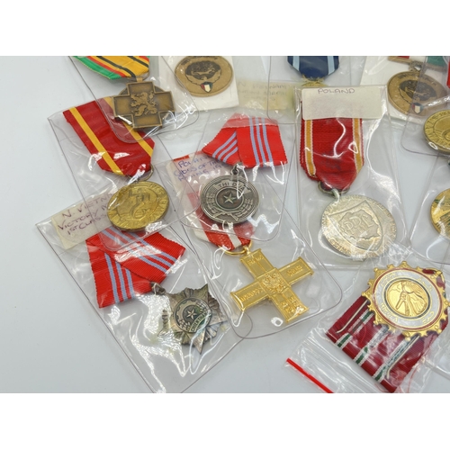 2304 - Fifteen WWII and later medals to include National Front for the Liberation of South Vietnam Resoluti... 