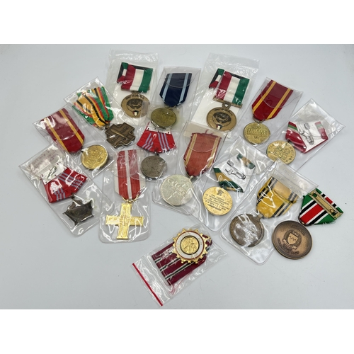 2304 - Fifteen WWII and later medals to include National Front for the Liberation of South Vietnam Resoluti... 