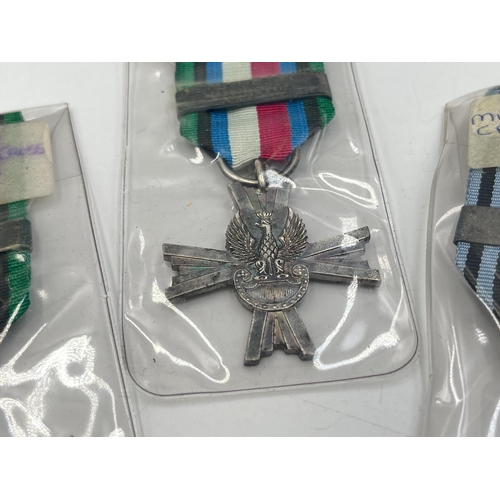 2305 - Three WWII 1939-1945 Polish Military Cross Of Combat medals to include Tobruk, Lagarde etc.