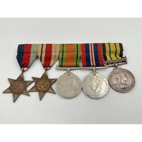 2309 - A WWII British medal group comprising The 1939-1945 Star, The Africa star, Defence, Victory and Afri... 