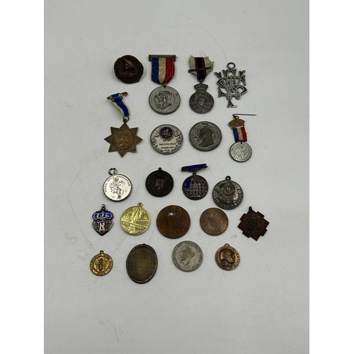 2139 - A collection of medallions and coins to include hallmarked Birmingham silver fob, North Staffs Royal... 