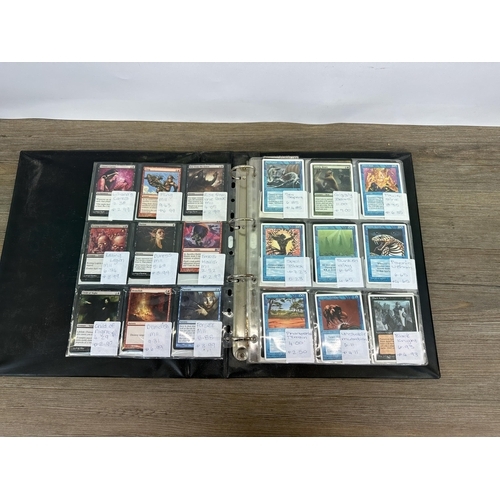 443 - Two albums containing a collection of Magic of the Gathering trading cards to include Gravedigger, G... 