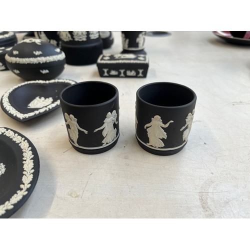 380 - Twenty three pieces of Wedgwood black Jasperware to include circular pedestal bowl, tobacco jar, can... 