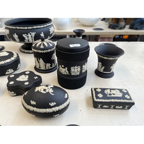 380 - Twenty three pieces of Wedgwood black Jasperware to include circular pedestal bowl, tobacco jar, can... 