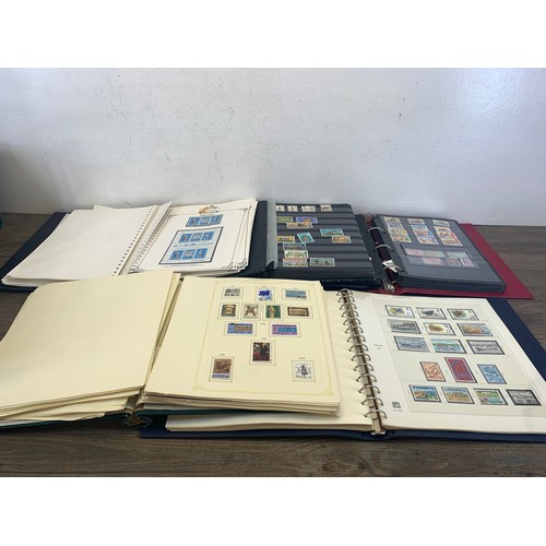 503 - Five stamp albums containing a collection of worldwide stamps