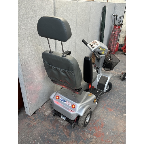 884 - A Rascal 388XL electric mobility scooter with battery charger