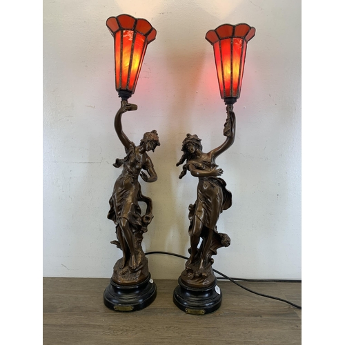 557 - A pair of 19th century style bronzed Charmeuse table lamps originally sculpted by Par L. More - appr... 