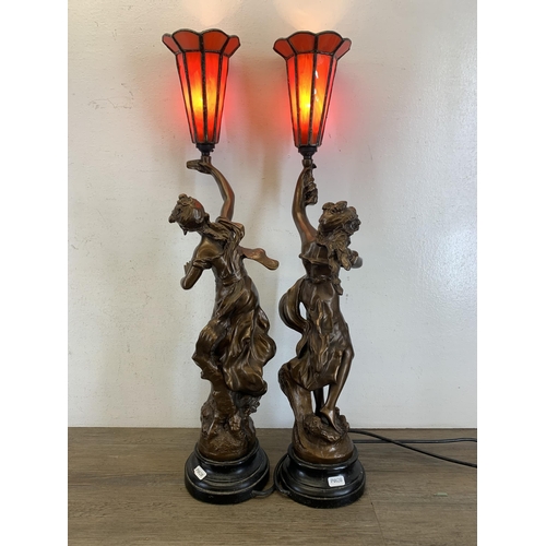 557 - A pair of 19th century style bronzed Charmeuse table lamps originally sculpted by Par L. More - appr... 