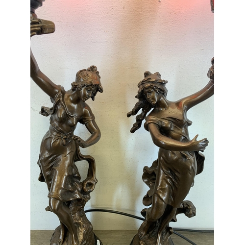 557 - A pair of 19th century style bronzed Charmeuse table lamps originally sculpted by Par L. More - appr... 