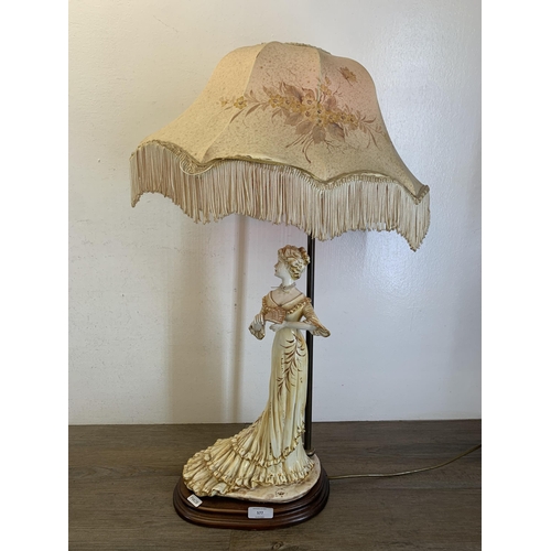 577 - A Capodimonte ceramic figural table lamp with hand painted floral shade - approx. 72cm high