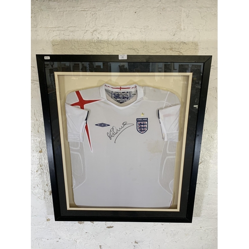 620 - Two items of signed football memrobilia, one framed England shirt signed 'M Owen' and one football s... 