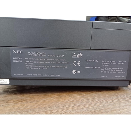 678 - A cased NEC MT830G+ MultiSync LCD projector with cables, remote control and instruction manual