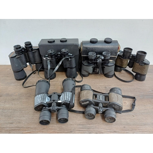 682 - A collection of binoculars to include cased Super Zenith 10x50 wide angle, cased Falcon 6x-18x zoom,... 