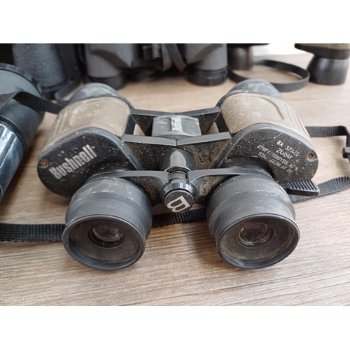 682 - A collection of binoculars to include cased Super Zenith 10x50 wide angle, cased Falcon 6x-18x zoom,... 