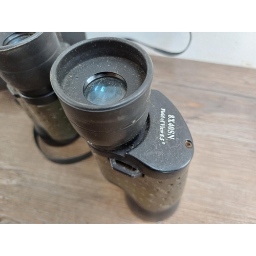 682 - A collection of binoculars to include cased Super Zenith 10x50 wide angle, cased Falcon 6x-18x zoom,... 