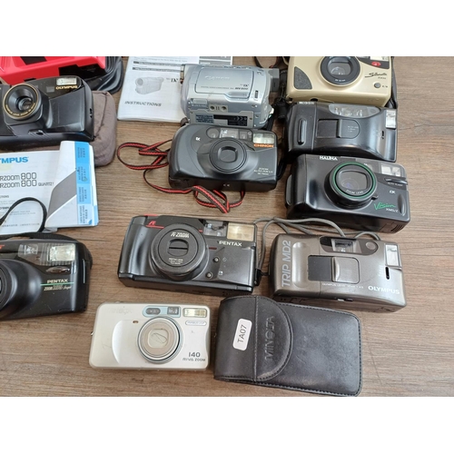 684 - A collection of camcorders and cameras to include two Olympus Trip MD2, Olympus Superzoom 800 with i... 