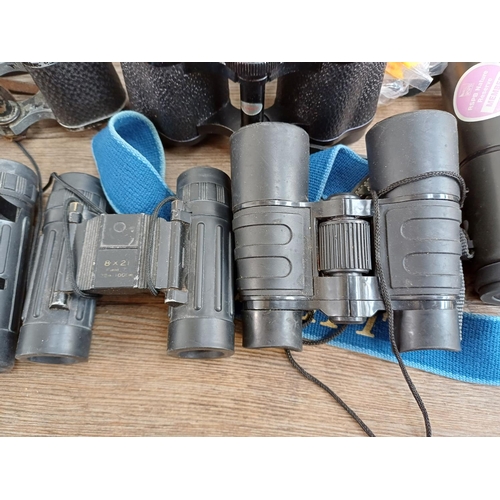 685 - A collection of binoculars to include cased Turners Novar De Luxe 8x30, Greenkat 8x30 extra wide ang... 