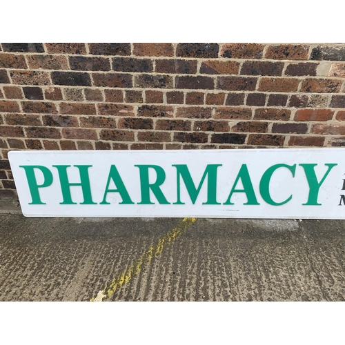 865 - A large acrylic Pharmacy sign - approx. 300cm wide x 52cm high