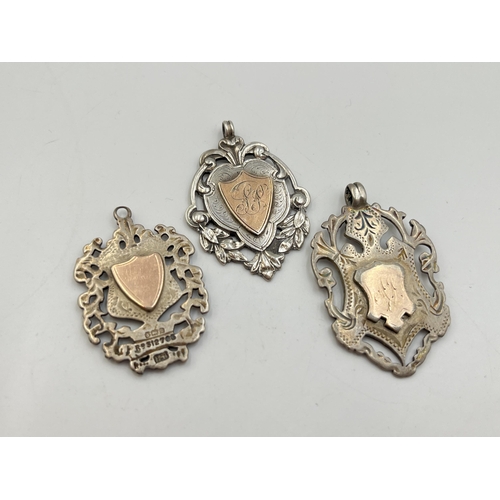 2066 - Three hallmarked Birmingham silver watch fobs/medallions - approx. gross weight 27.6g