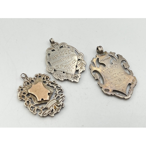 2066 - Three hallmarked Birmingham silver watch fobs/medallions - approx. gross weight 27.6g