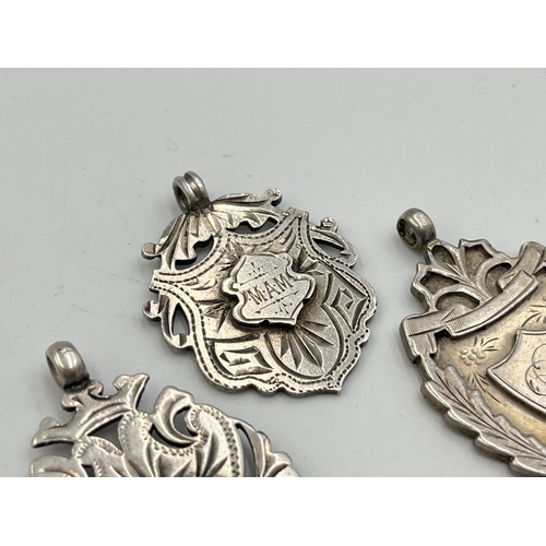 2068 - Three hallmarked Birmingham silver watch fobs/medallions - approx. gross weight 23.9g