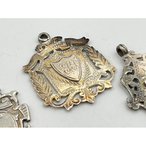 2069 - Three hallmarked Birmingham silver watch fobs/medallions - approx. gross weight 24.7g