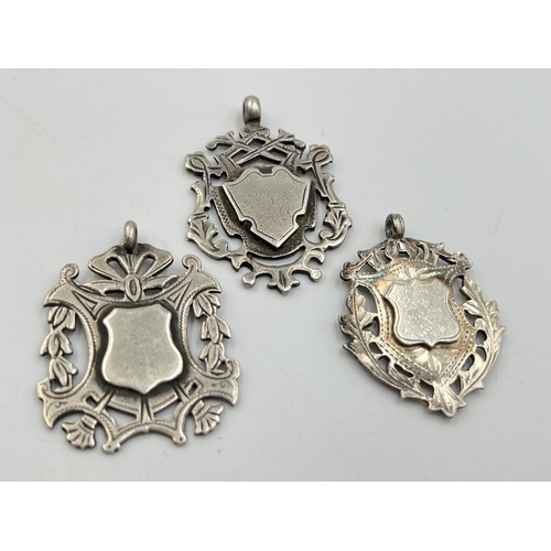 2070 - Three hallmarked Birmingham silver watch fobs/medallions - approx. gross weight 27.3g