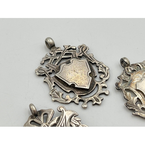 2070 - Three hallmarked Birmingham silver watch fobs/medallions - approx. gross weight 27.3g