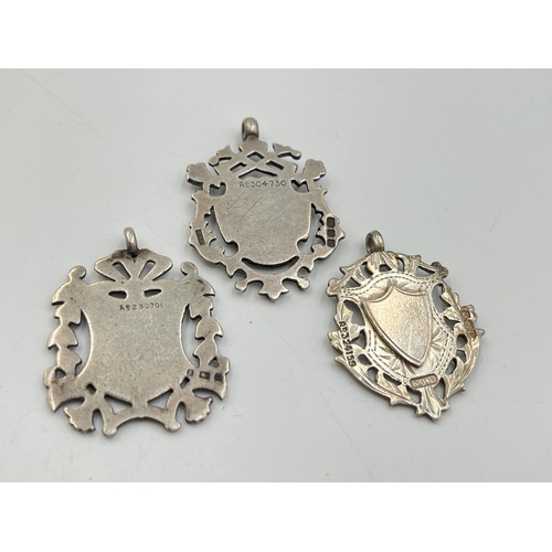 2070 - Three hallmarked Birmingham silver watch fobs/medallions - approx. gross weight 27.3g