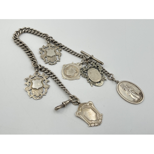 2073 - A hallmarked silver Albert chain with six watch fobs, five hallmarked Birmingham and one Albo silver... 