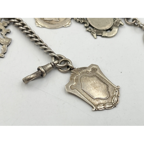 2073 - A hallmarked silver Albert chain with six watch fobs, five hallmarked Birmingham and one Albo silver... 