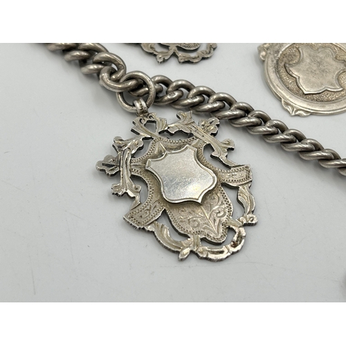 2073 - A hallmarked silver Albert chain with six watch fobs, five hallmarked Birmingham and one Albo silver... 