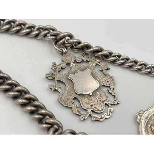 2073 - A hallmarked silver Albert chain with six watch fobs, five hallmarked Birmingham and one Albo silver... 