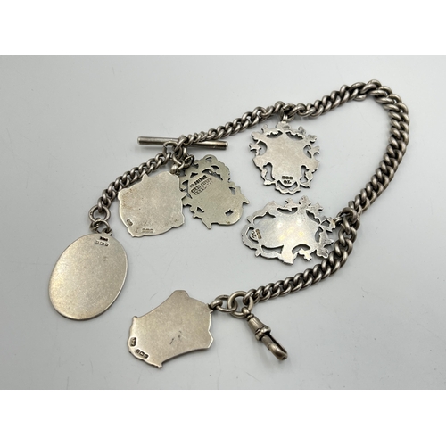 2073 - A hallmarked silver Albert chain with six watch fobs, five hallmarked Birmingham and one Albo silver... 