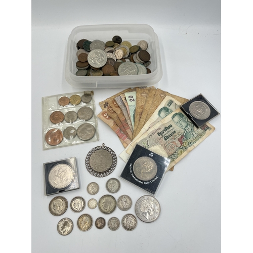 2087 - A collection of world banknotes and coins with silver examples to include 83.5% 1909 and 1914 Swiss ... 