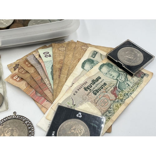 2087 - A collection of world banknotes and coins with silver examples to include 83.5% 1909 and 1914 Swiss ... 