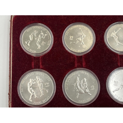 2088 - A cased set of eight 1988 Seoul Olympics South Korean commemorative non-circulating coins, four 1000... 