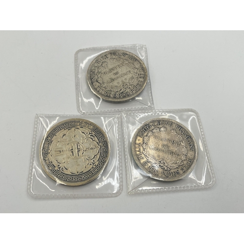 2091 - Three silver plated replica coins, two 1907 French Indochina one piastre and one 1930 British trade ... 