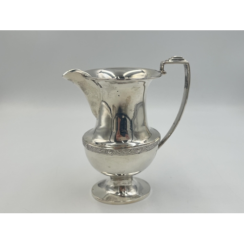 2095 - A Duncan & Scobbie hallmarked Birmingham silver milk jug, dated 1939 - approx. gross weight 132g and... 