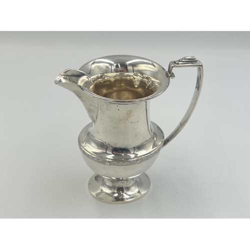 2095 - A Duncan & Scobbie hallmarked Birmingham silver milk jug, dated 1939 - approx. gross weight 132g and... 