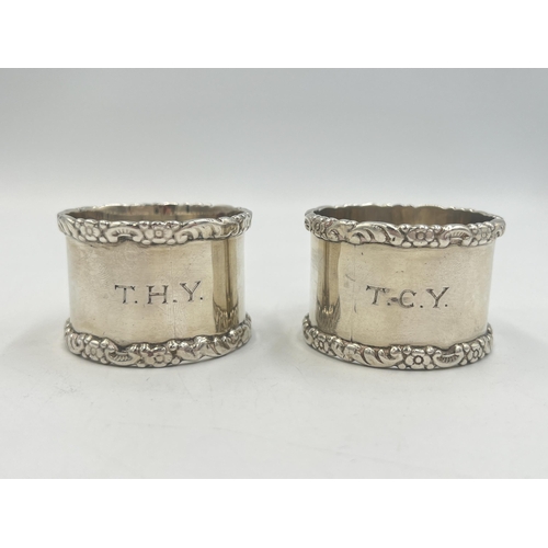 2100 - Two William Hutton & Sons hallmarked Birmingham silver napkin rings, one dated 1915 and one dated 19... 