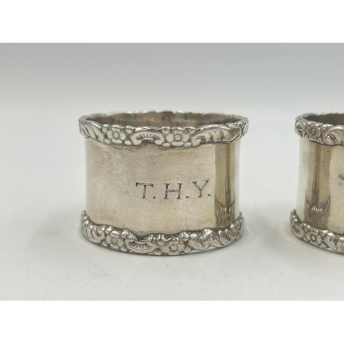 2100 - Two William Hutton & Sons hallmarked Birmingham silver napkin rings, one dated 1915 and one dated 19... 