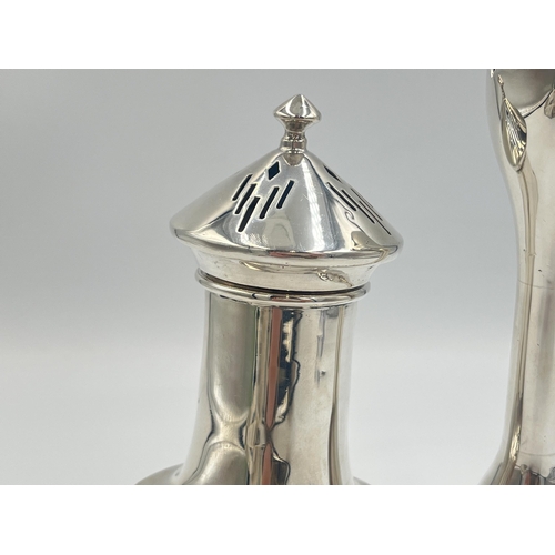 2101 - Two pieces of hallmarked Birmingham silver, one Bishton's Ltd. tulip vase, dated 1969 and one Duncan... 