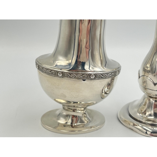 2101 - Two pieces of hallmarked Birmingham silver, one Bishton's Ltd. tulip vase, dated 1969 and one Duncan... 